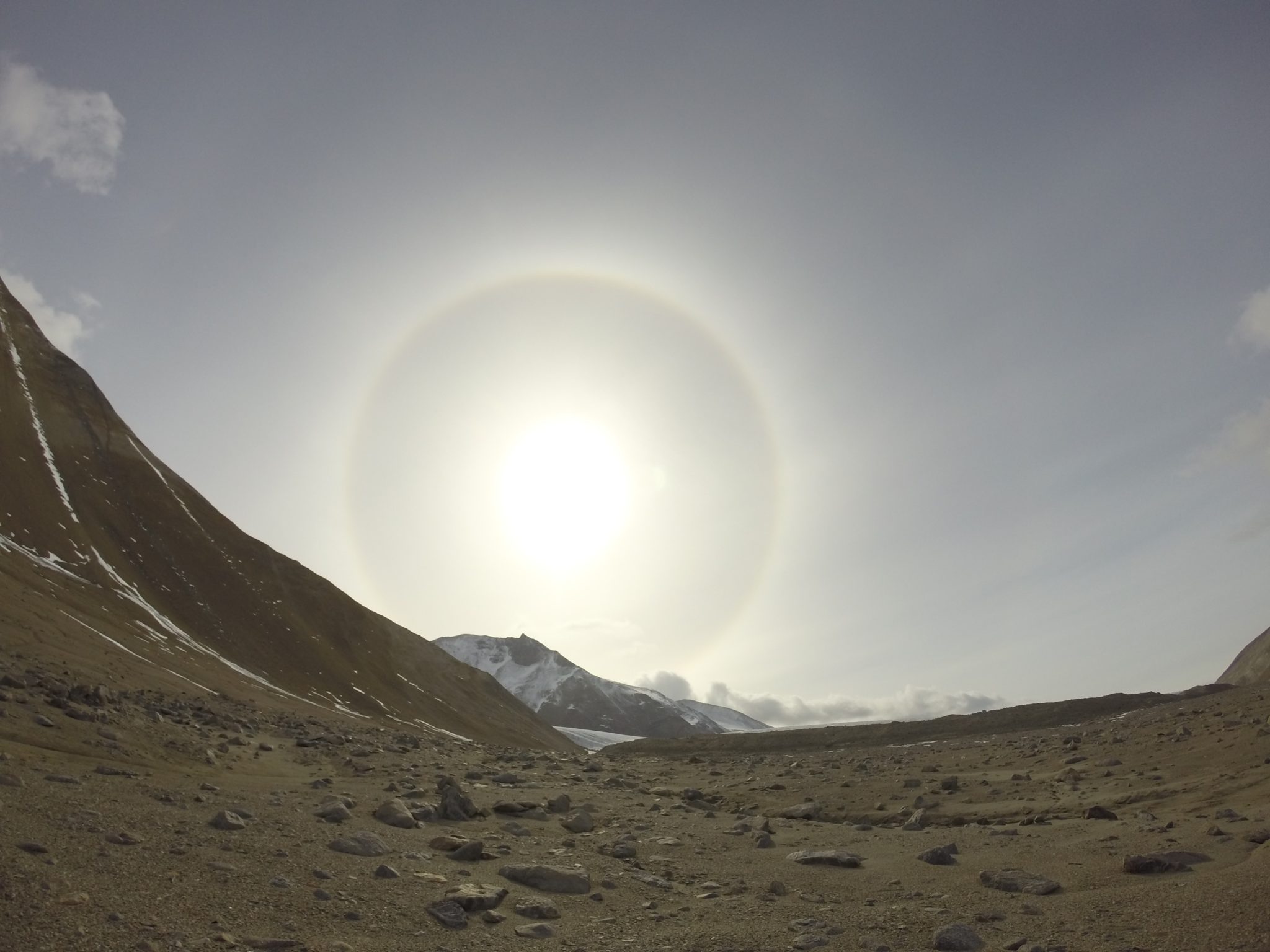 color photo of the sun looming large in Garwood Valley, Antarctica