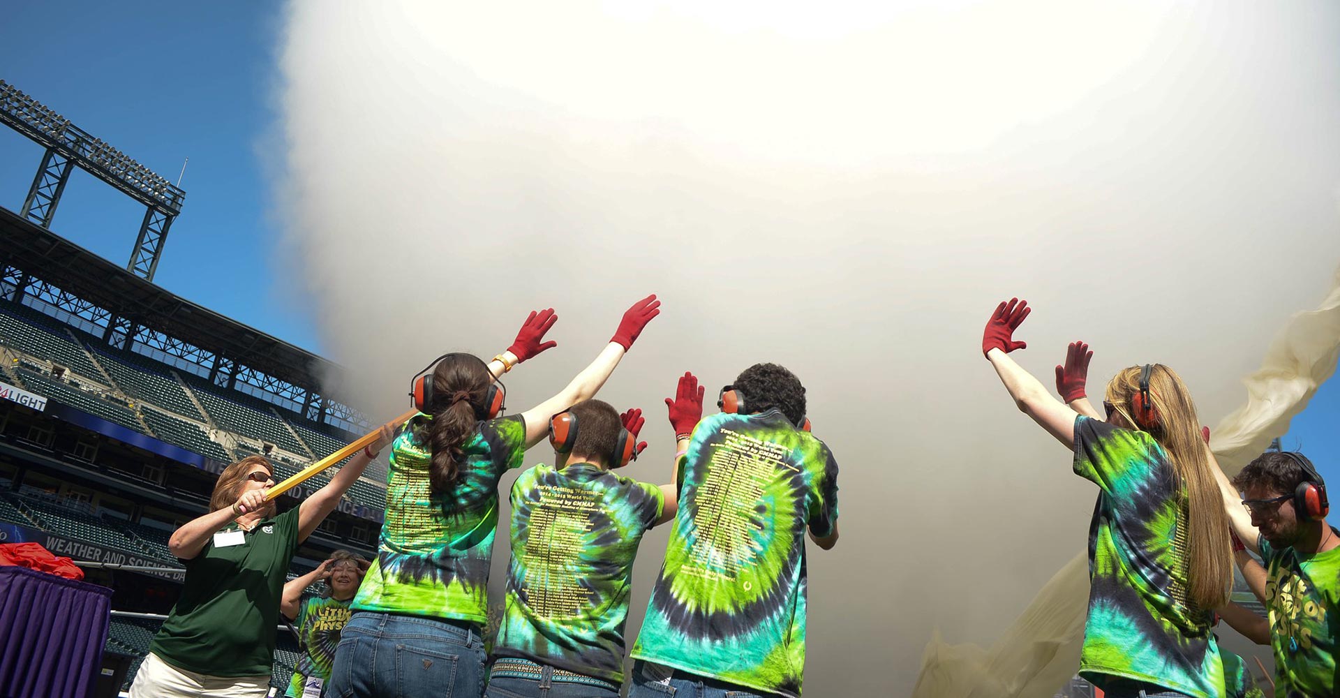 volunteers using smoke cannon outdoors