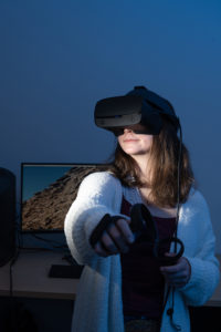 student with vr headset