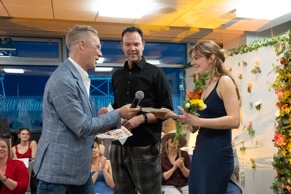 Elise being presented with flowers