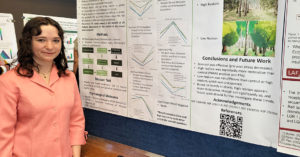 Rachel Masters in front of her award-winning project poster.