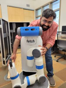 CSU's assistant professor Sarath Sreedharan and the Department of Computer Science's new robot- "Shakey Jr."